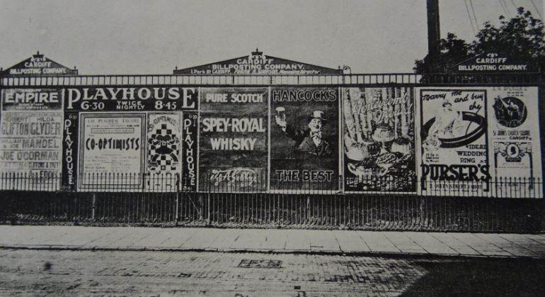 Billboards on Newport Rod, Cardiff in the 1920s opposite the bus depot