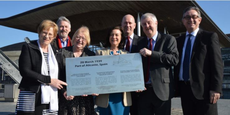 Mark Drakeford with the plaque in 2019