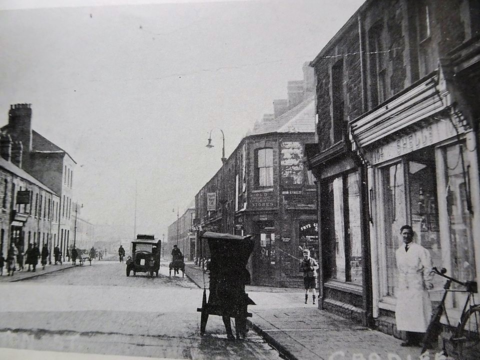 Clifton Street 1910 - Iron Street going off on the right. The man is stnding outside Shell's, the Pork Butchers